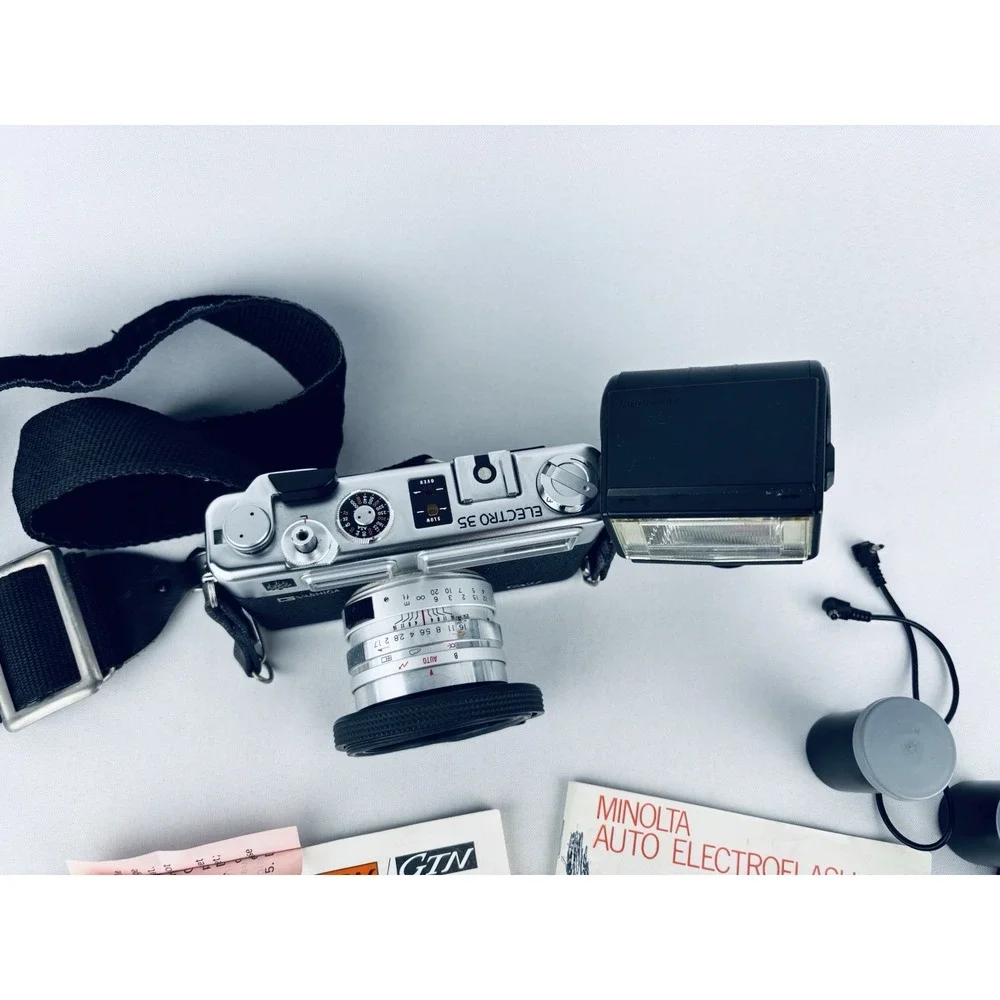 Yashica Vintage Electro 35 GSN Camera & Minolta Electroflash 28 & Film & Books